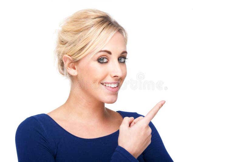 Mulher atraente a apontar para algo fotos de stock