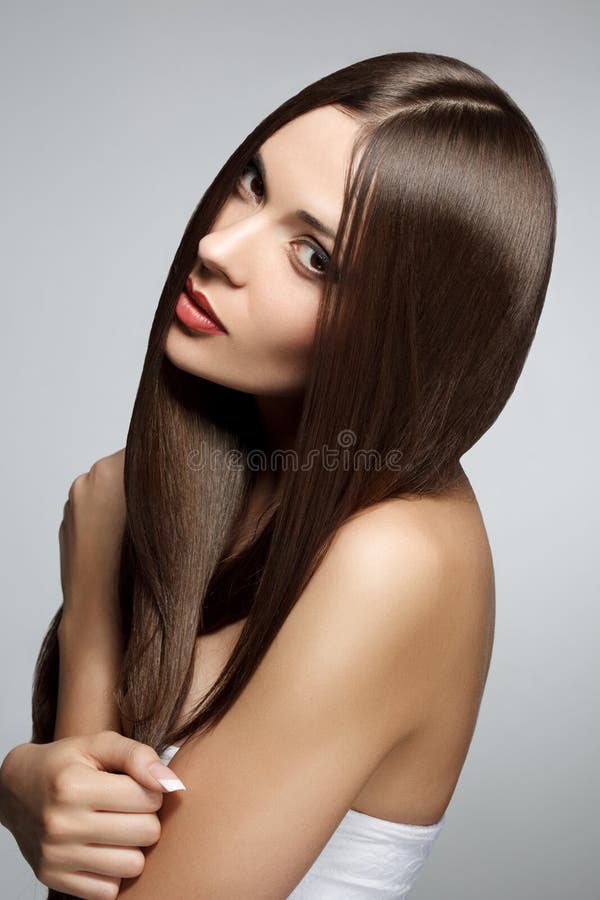 Mulher bonita com cabelo longo saudável fotografia de stock Mulher bonita com cabelo longo saudável fotografia de stock