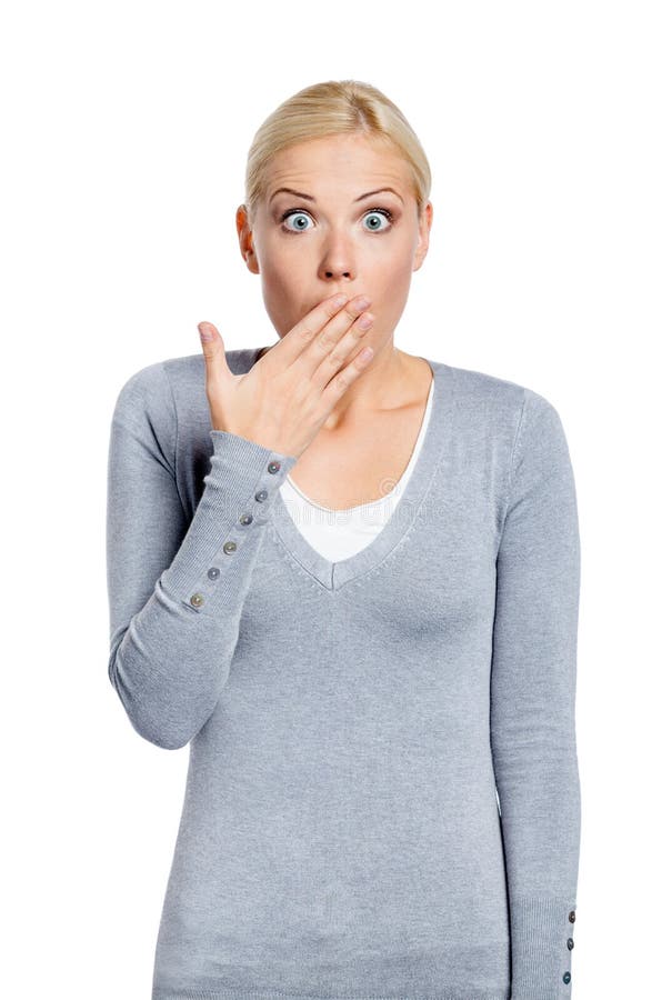 Mulher chocada cobre a boca com a mão imagem de stock royalty free