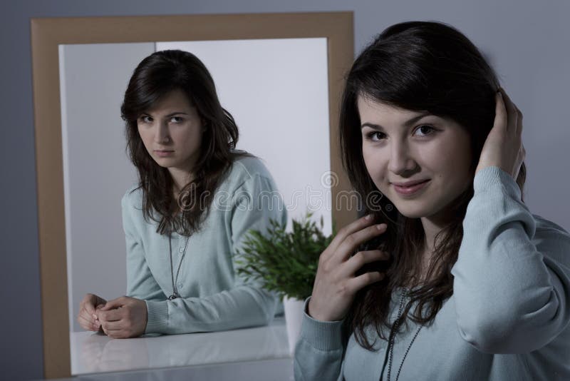 Woman with psychiatric disorder smothering her emotions. Woman with psychiatric disorder smothering her emotions