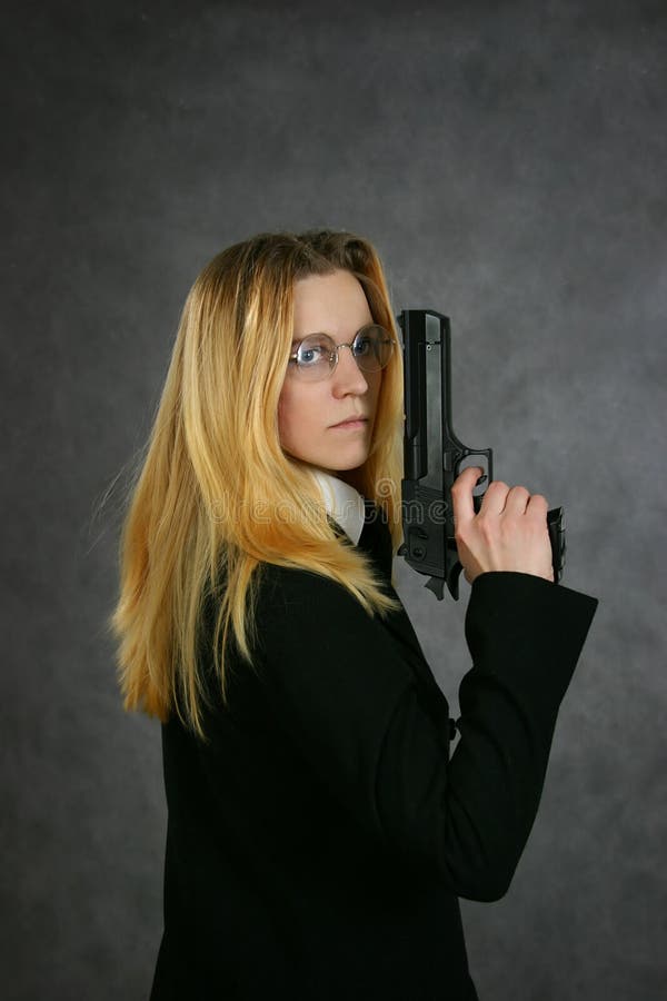 Mulher com a arma imagem de stock