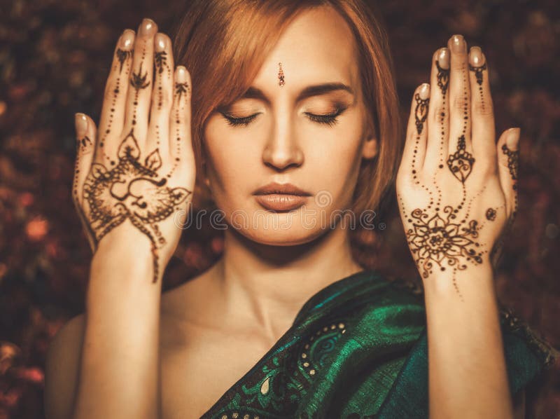 Woman with traditional mehndi henna ornament. Woman with traditional mehndi henna ornament