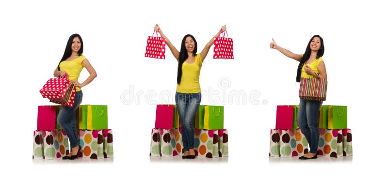 A mulher com os sacos de compras isolados no branco imagens de stock royalty free A mulher com os sacos de compras isolados no branco imagens de stock royalty free
