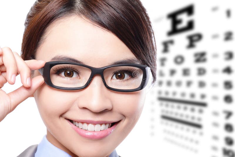 Business woman with glasses on the background of eye test chart, eye care concept, asian beauty. Business woman with glasses on the background of eye test chart, eye care concept, asian beauty