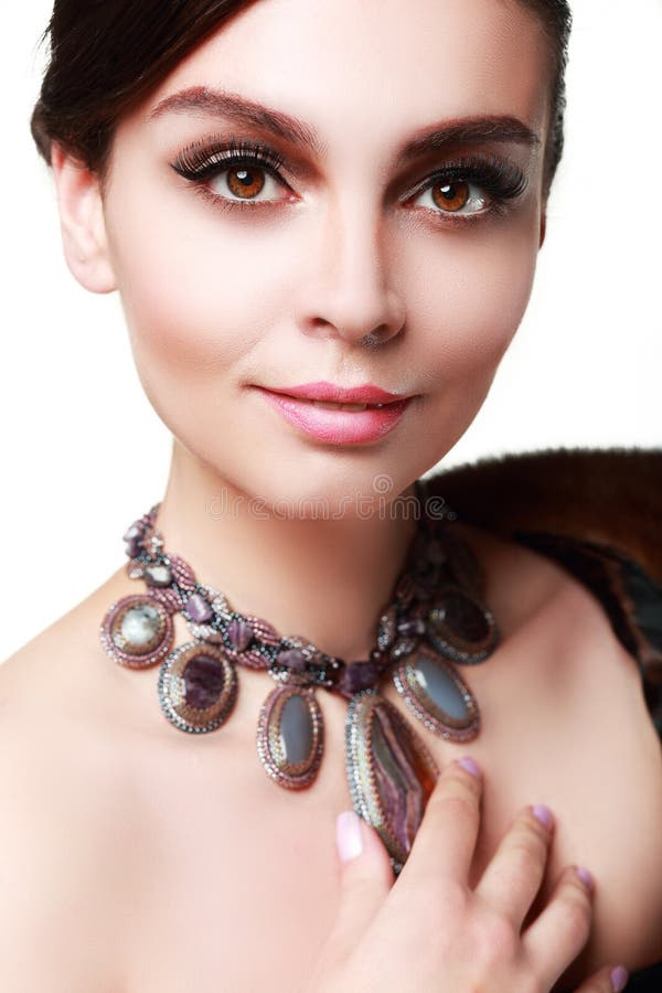 Beautiful woman with evening make-up. Jewelry and Beauty. Fashion photo. Beautiful woman with evening make-up. Jewelry and Beauty. Fashion photo