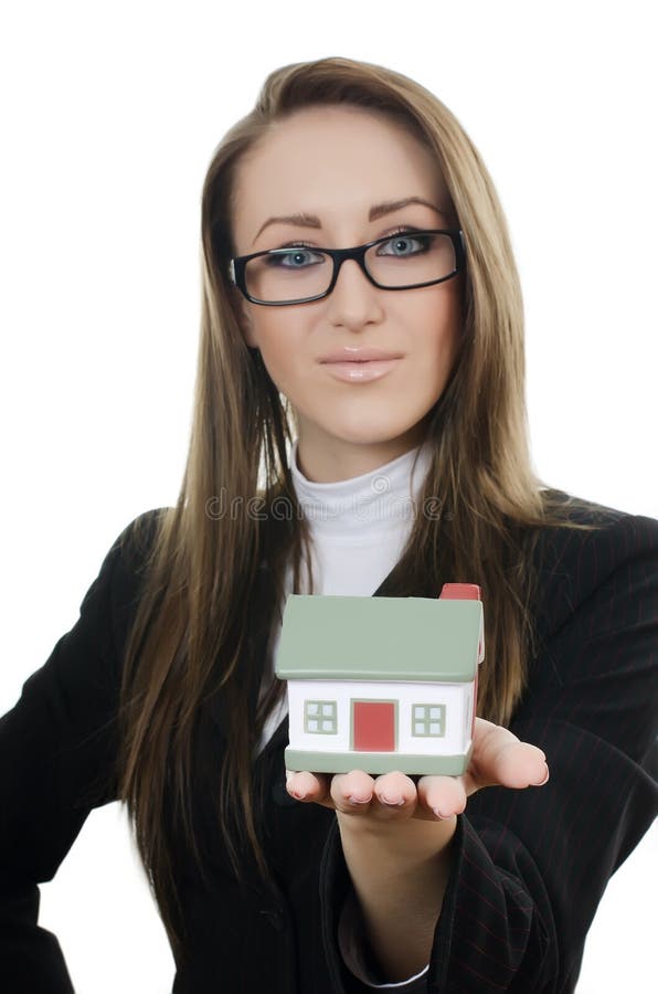 A mulher de negócios com um modelo pequeno da casa foto de stock royalty free