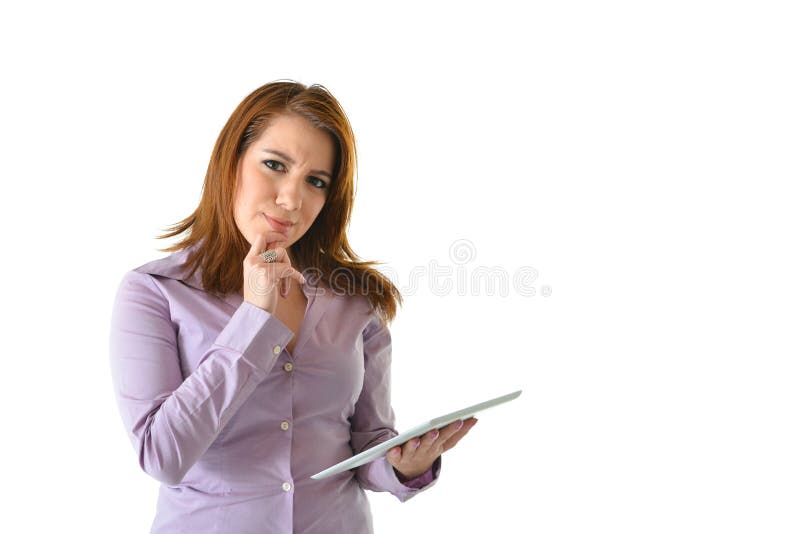 Business woman thinking while working on a tablet computer. Business woman thinking while working on a tablet computer