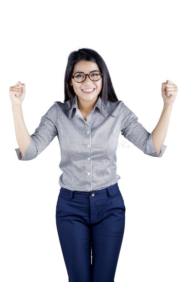 A mulher de negócios bonita comemora seu sucesso no estúdio imagem de stock A mulher de negócios bonita comemora seu sucesso no estúdio imagem de stock