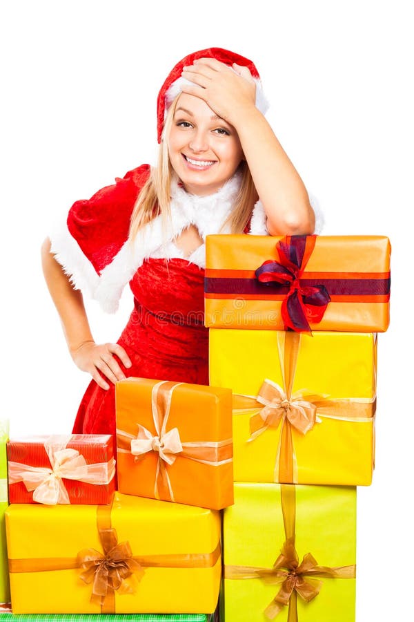 Mulher de Santa e presentes de sorriso do Natal foto de stock Mulher de Santa e presentes de sorriso do Natal foto de stock