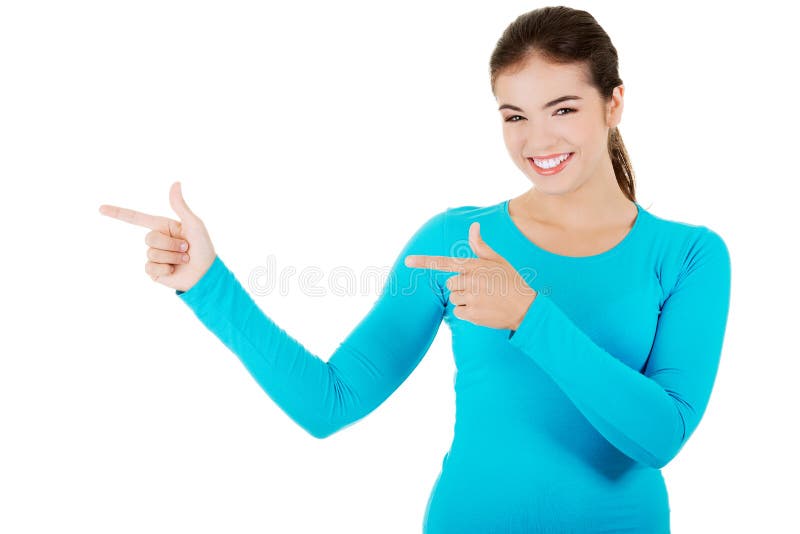 Mulher feliz a apontar para a esquerda foto de stock royalty free