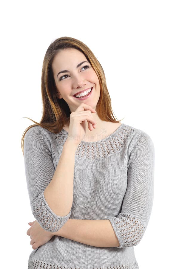 Mulher feliz a pensar e a olhar para o lado foto de stock