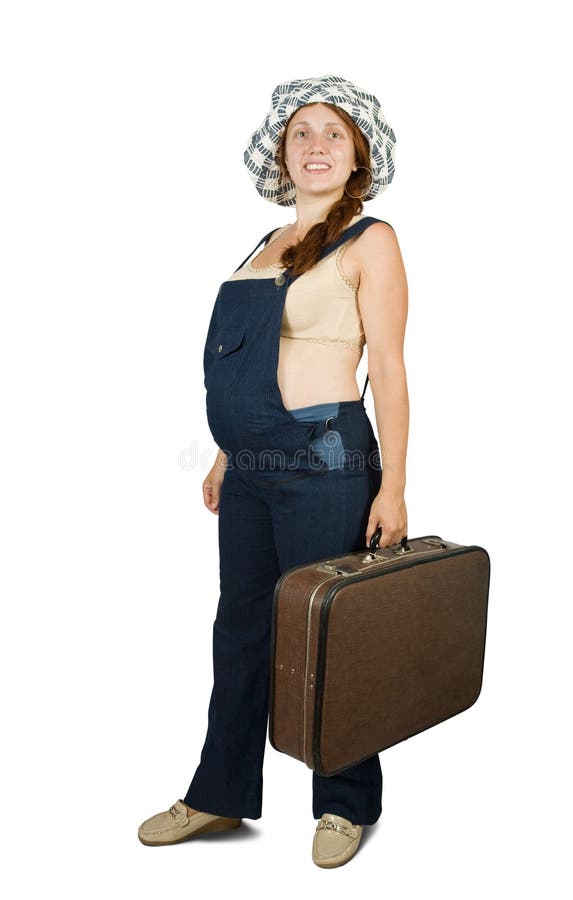 Mulher gravida que está com mala de viagem fotos de stock royalty free Mulher gravida que está com mala de viagem fotos de stock royalty free
