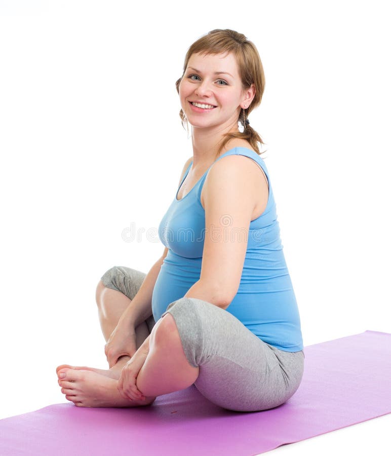 Mulher gravida que faz os exercícios ginásticos isolados imagem de stock royalty free Mulher gravida que faz os exercícios ginásticos isolados imagem de stock royalty free