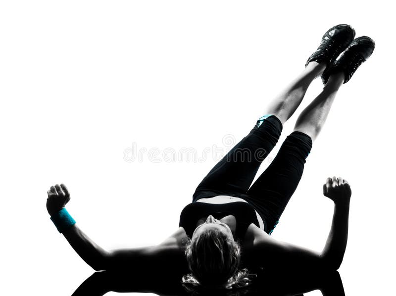 A mulher os abdominals da postura que da aptidão do exercício empurram levanta imagem de stock royalty free A mulher os abdominals da postura que da aptidão do exercício empurram levanta imagem de stock royalty free