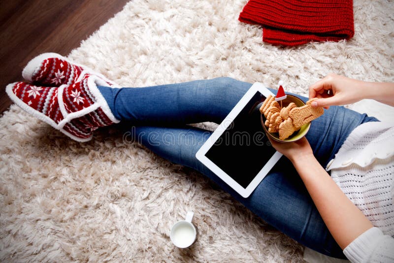 Woman eating biscuits at home. Woman eating biscuits at home