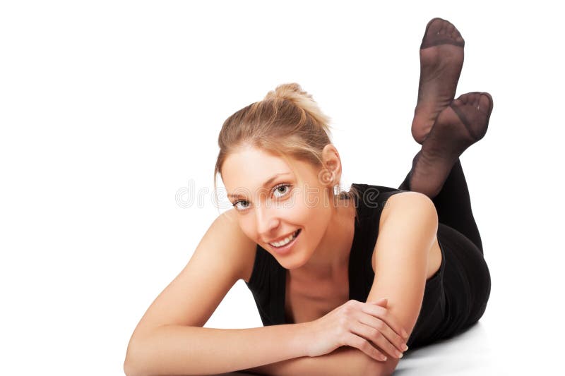 Mulher que encontra-se no assoalho isolado fotografia de stock Mulher que encontra-se no assoalho isolado fotografia de stock