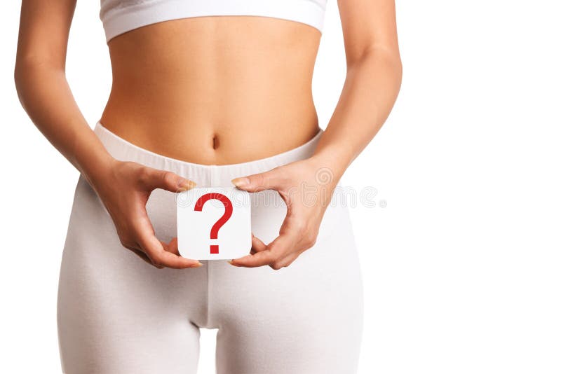 Woman holding question mark over her abdomen, white background. Woman holding question mark over her abdomen, white background