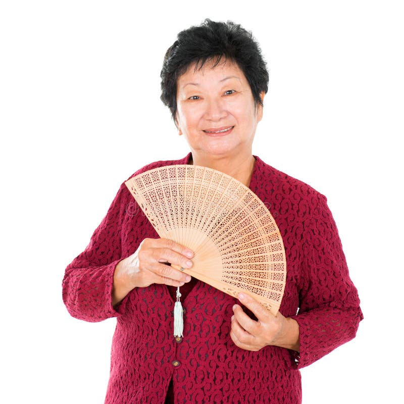 Mulher superior oriental com ventilador chinês foto de stock Mulher superior oriental com ventilador chinês foto de stock