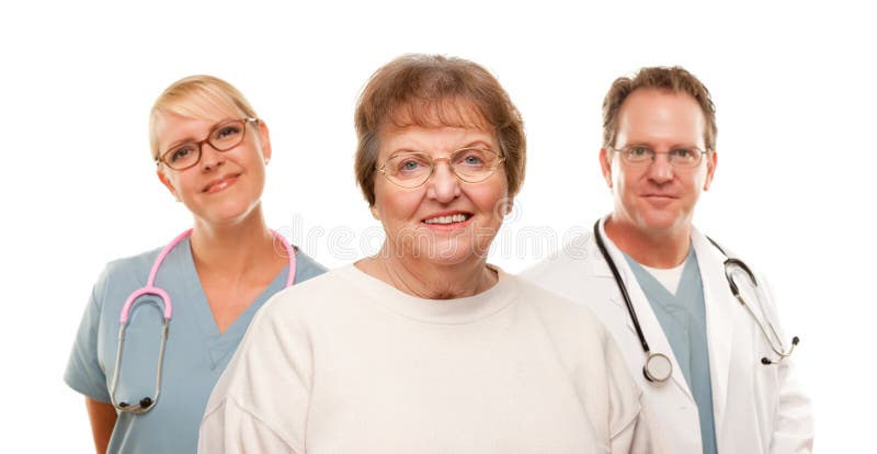 Mulher sênior de sorriso com médico e enfermeira imagens de stock royalty free Mulher sênior de sorriso com médico e enfermeira imagens de stock royalty free