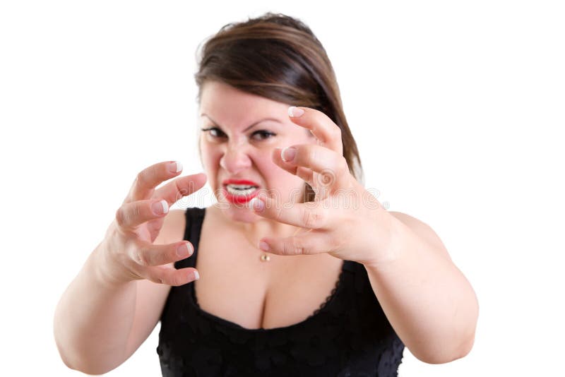 Mulher temperamental furioso que agarra suas mãos imagem de stock Mulher temperamental furioso que agarra suas mãos imagem de stock