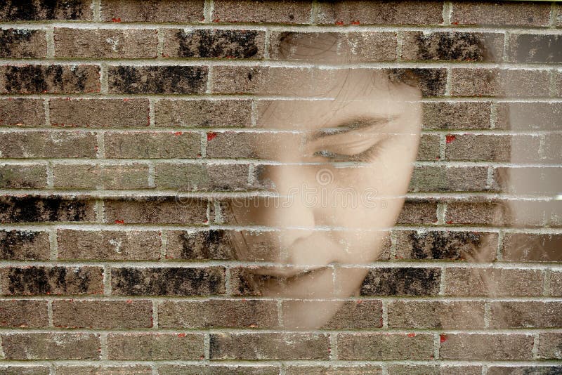 Woman blind into brick wall depressed. Woman blind into brick wall depressed