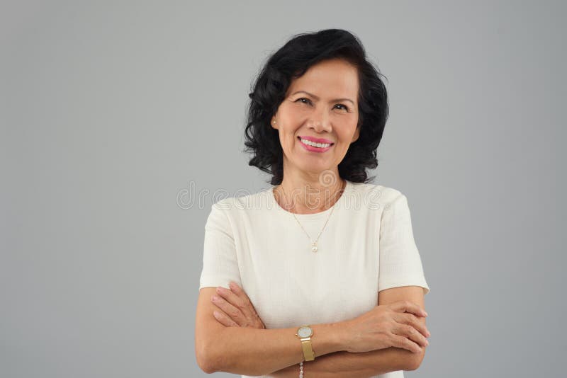 Mulher vietnamiana de meia idade imagem de stock Mulher vietnamiana de meia idade imagem de stock