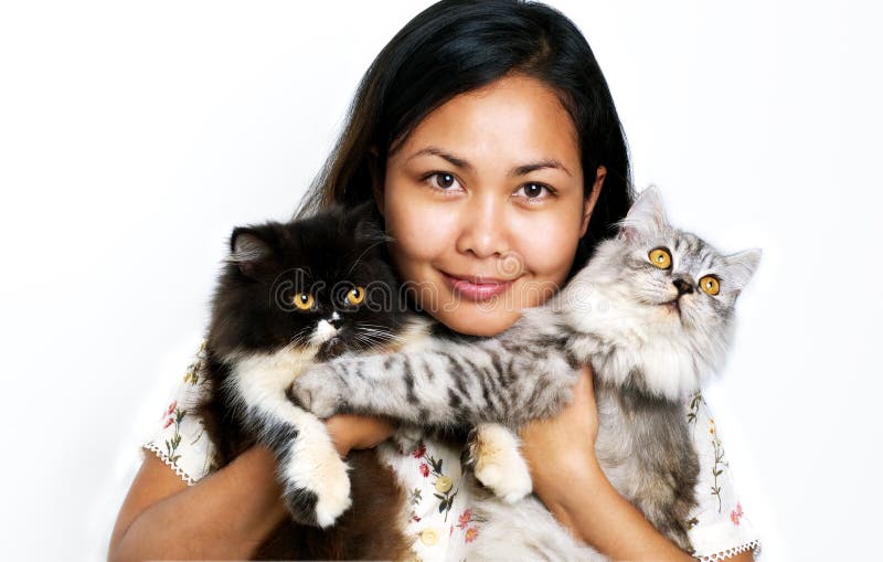 Mulheres com dois gatos imagem de stock Mulheres com dois gatos imagem de stock
