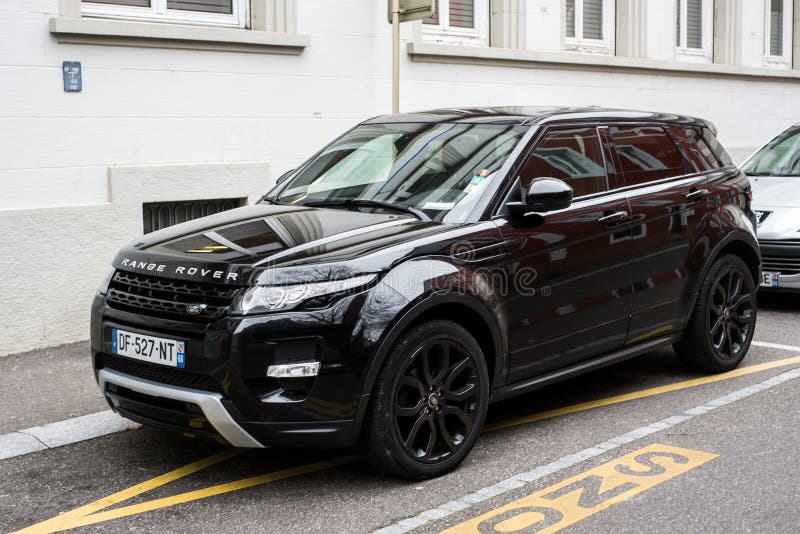 Front view of black range rover parked in the street