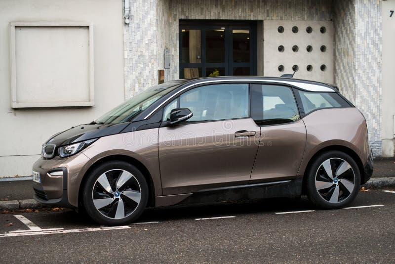 Mulhouse - France - 23 January 2021 - Profile view of brown BMW I3 electric car parked in the street