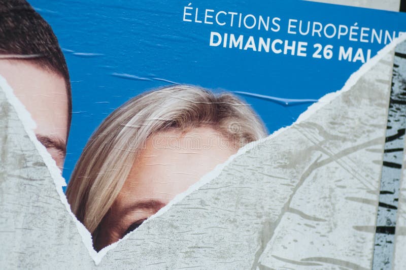 Torn posters of political party leaders ones of the candidates running in the May 2019 european elections
