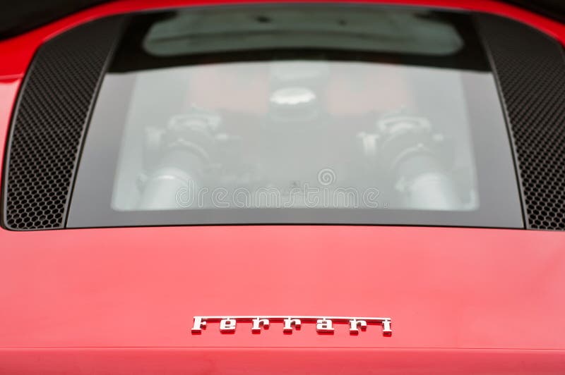Ferrari logo and V8 engine on red Ferrari 360 modena sport car parked in the street stock photography Ferrari logo and V8 engine on red Ferrari 360 modena sport car parked in the street stock photography