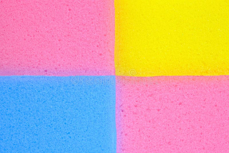 Multi-colored background of pink, blue and yellow foam sponges. Multi colored foam sponges stock images, royalty-free photos and pictures