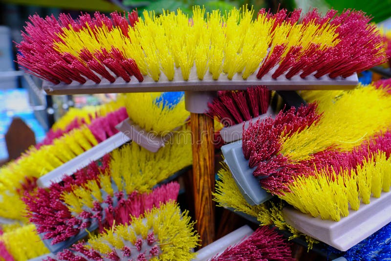Multicolored Bright Brushes, Mops for Manual Cleaning of Premises from