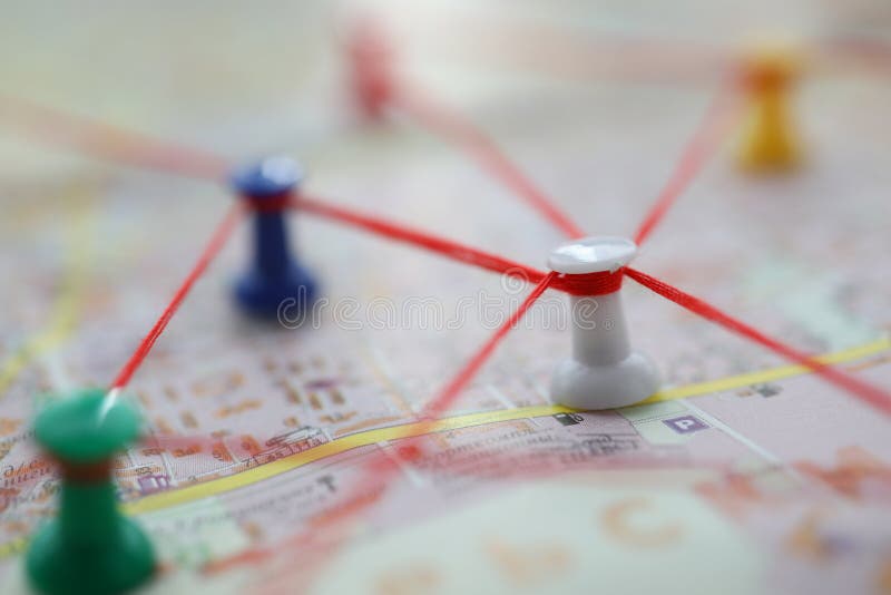 Multi-colored buttons pinned on a map of the area. Concept of planning exit from a problem business. Investigation of causes and effects
