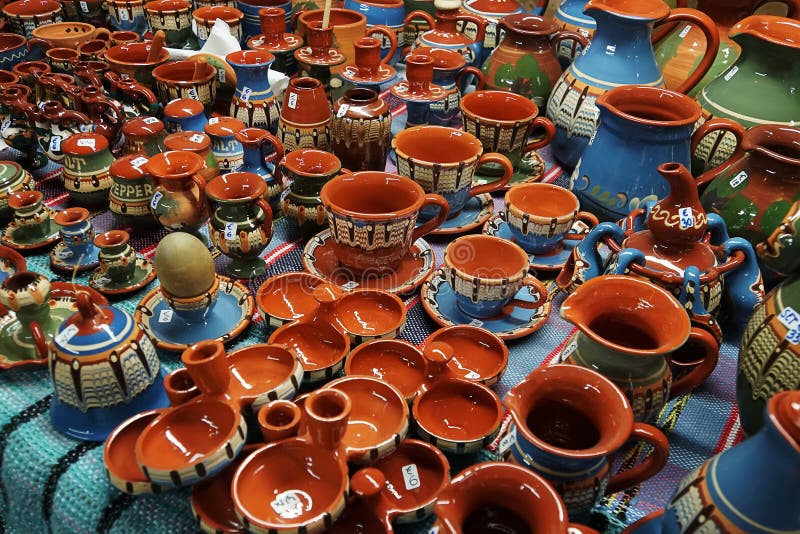 Multi-colored ceramic mugs on counter of the store. Antique dishes. Reconstruction of medieval dishes. Painting on ceramics royalty free stock photos Multi-colored ceramic mugs on counter of the store. Antique dishes. Reconstruction of medieval dishes. Painting on ceramics royalty free stock photos