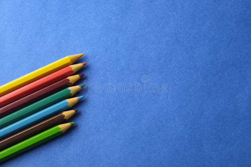 Multi Colored Crayons at Blue Background with Copy Space Stock Image