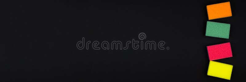 New multi-colored foam sponges on a black background. Multi colored foam sponges stock images, royalty-free photos and pictures
