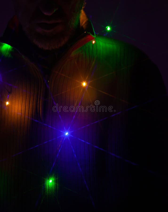 Multi-colored garland on a man neck royalty free stock image