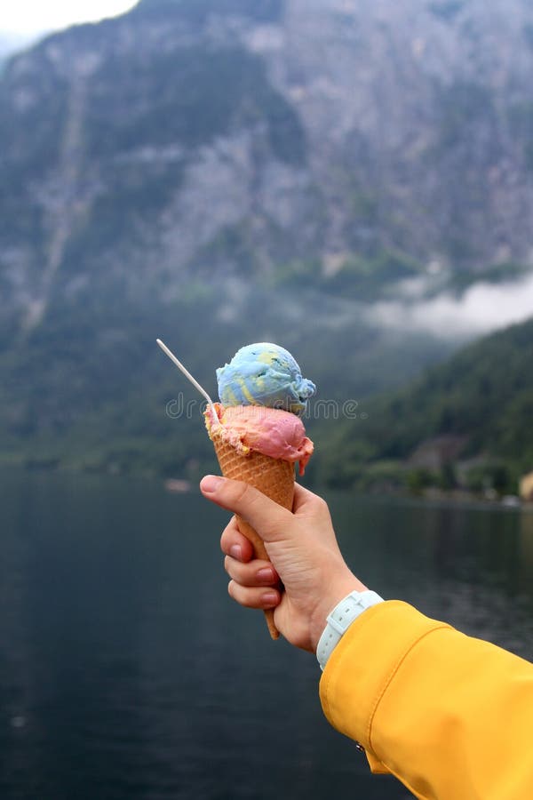 Multicolored Ice Cream in a Horn in a Hand Stock Photo Image of