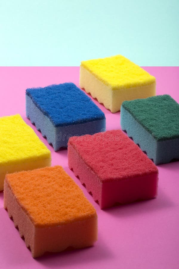 Multi-colored kitchen sponges on a colored background. Multi colored foam sponges stock images, royalty-free photos and pictures