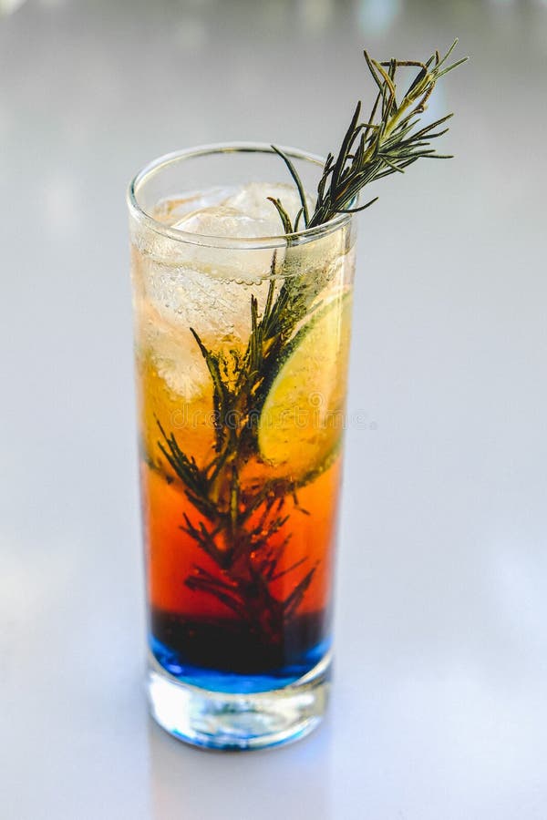 Multi Colored Long Island Cocktail With Rosemary Stock Image - Image of ...