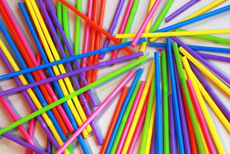 Multi colored plastic straws spread on a table, full frame stock image Multi colored plastic straws spread on a table, full frame stock image