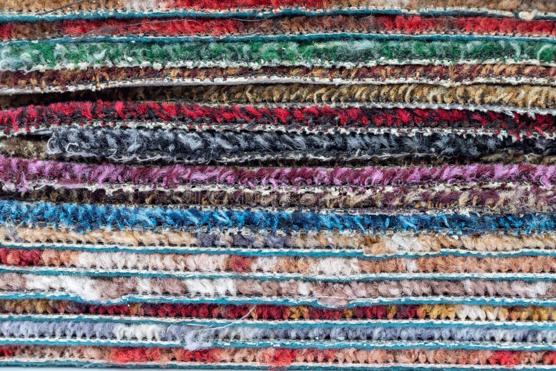 Multi-coloured rugs or carpets stack over each other. colourful texture background. Motley carpets stock images, royalty-free photos and pictures
