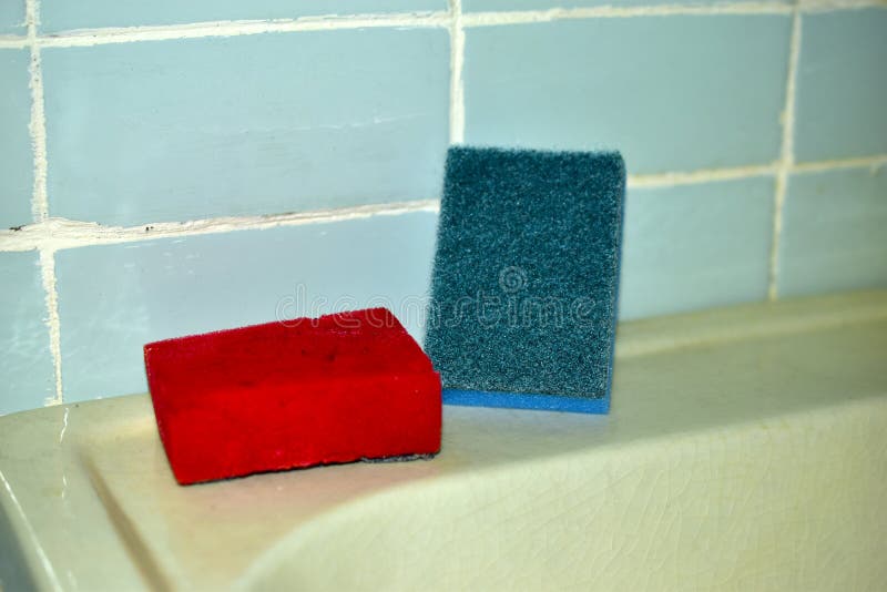 Multi-colored sponges for cleaning in the bathroom on the sink. Washing sponge for dishes is an indispensable assistant in the kitchen, which is used by everyone without exception. such a product has different shapes and is also made of different materials, which distinguishes their applications and special functions. In order for cleaning to be effective, it is necessary to clearly understand the purpose of the washing sponge, so as not to be disappointed in the result. Sponges for washing dishes. 1. Foam; 2. abrasive; 3. metal; 4. plastic; 5. microfiber; 6. melamine; 7. cellulose. Multi colored foam sponges stock images, royalty-free photos and pictures