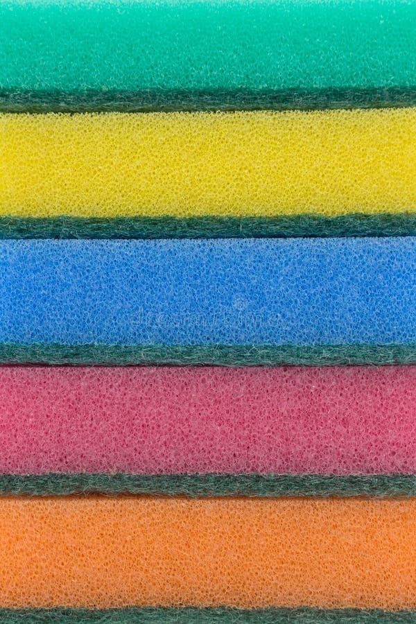 Multi-colored sponges for household work from foam rubber, stack, on a white background. Multi colored foam sponges stock images, royalty-free photos and pictures