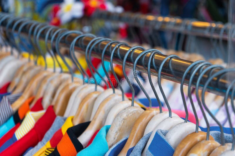 Multi-colored T-shirts on a Hanger. Clothing Store Stock Image - Image ...