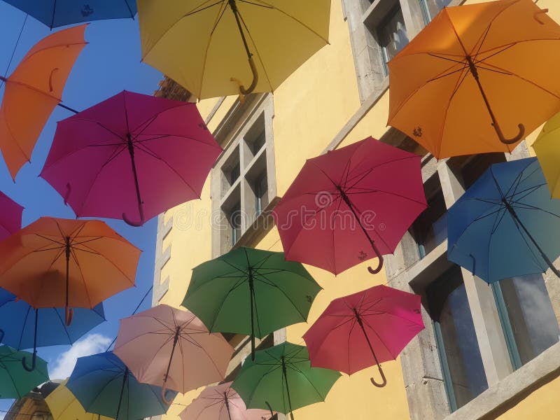 Multicolored Umbrellas that Protect Passersby from Rain and Sun on