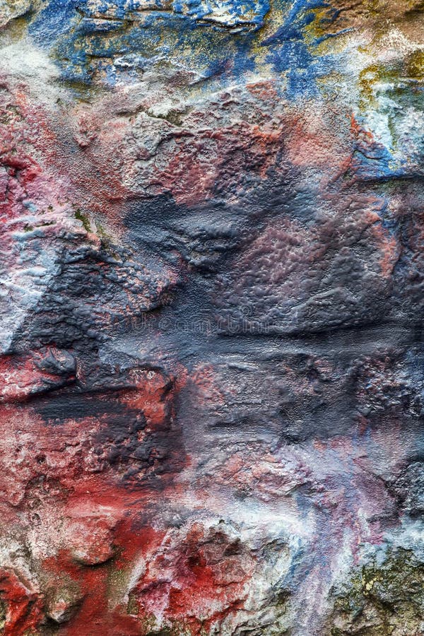 Multi coloured painted stone brick wall background royalty free stock photography
