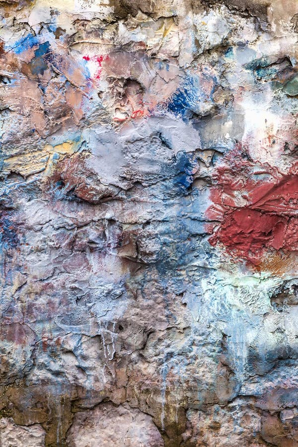 Multi coloured painted stone brick wall background royalty free stock image