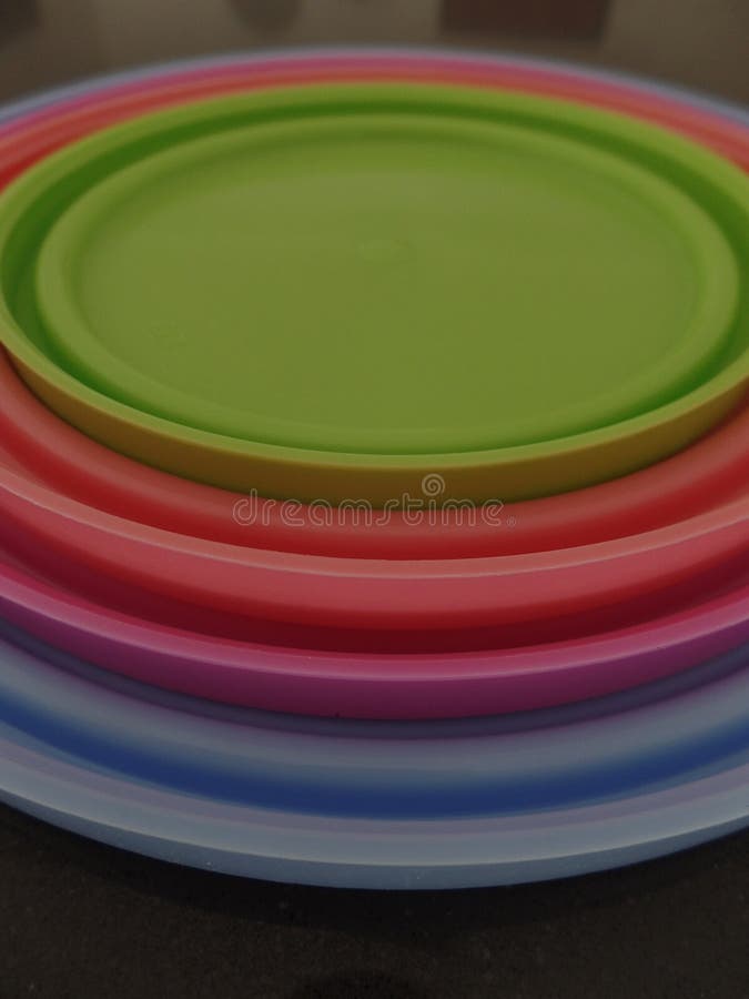 Multi coloured round plastic lids stock images